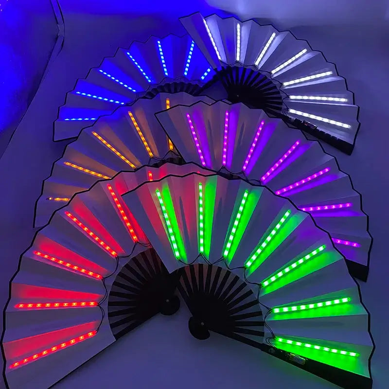 LED glow folding fans in vibrant colors, perfect for dance and stage performances, displayed in a dark setting for impact.