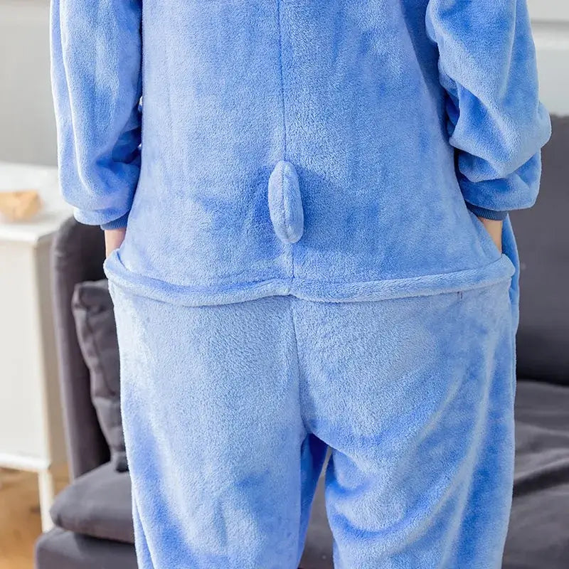 Cozy blue Stitch onesie costume with hood and tail detail, flannel fabric, unisex design, perfect for lounging or parties.