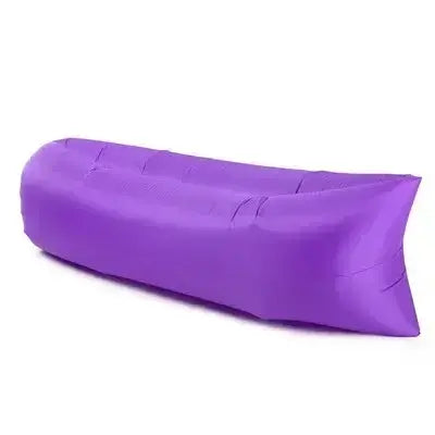 Purple portable inflatable air lounger sofa for outdoor use, ideal for camping, beach, and backyard relaxation.