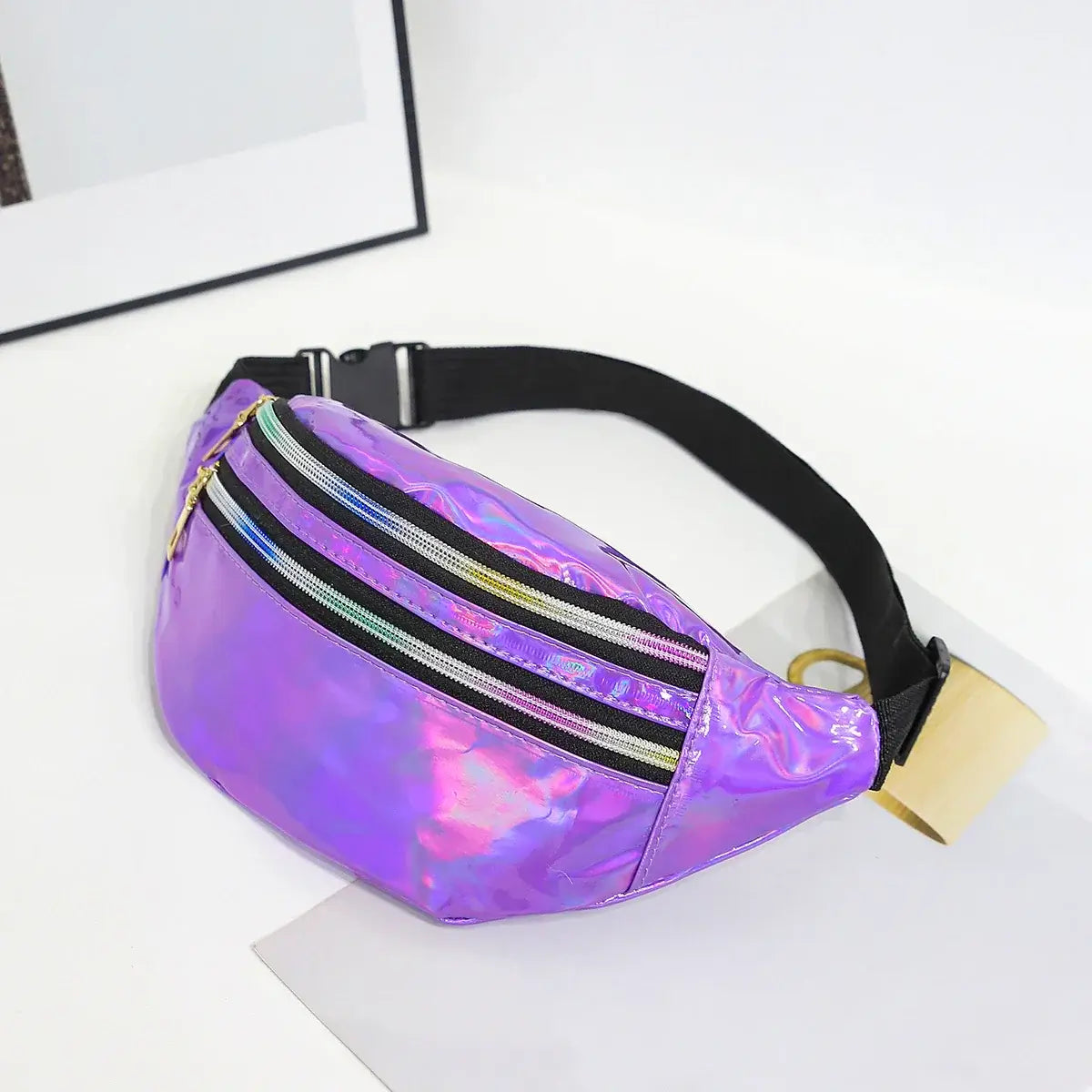 Holographic laser waist bag in purple, versatile unisex design, ideal for festivals, travel, and daily use. Durable and stylish PVC material.