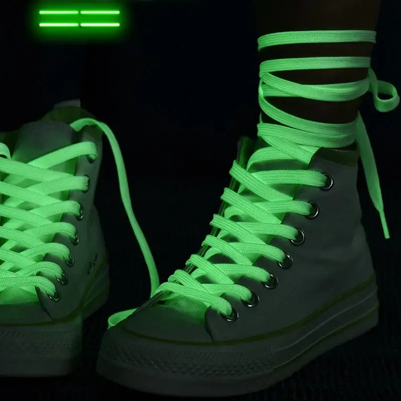 Luminous fluorescent shoelaces glowing in the dark, ideal for parties, night runs, and rave events, on stylish sneakers.