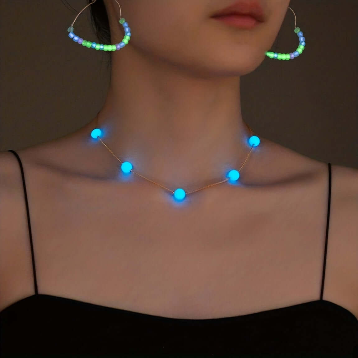 Glowing luminous bead necklace and earring set with heart design, perfect for festivals, parties, and nighttime adventures.