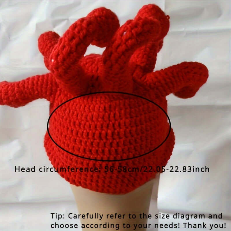 Red handmade knitted festival hat with octopus eye design, measuring 56-58 cm head circumference, perfect for quirky costumes