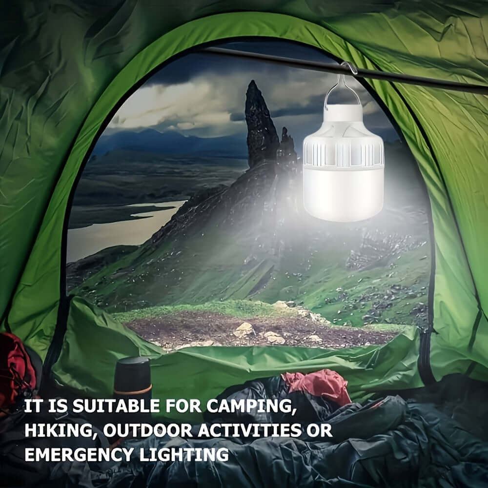 Portable USB rechargeable LED camping lantern hanging in a tent with a scenic outdoor view, ideal for camping and emergency lighting.