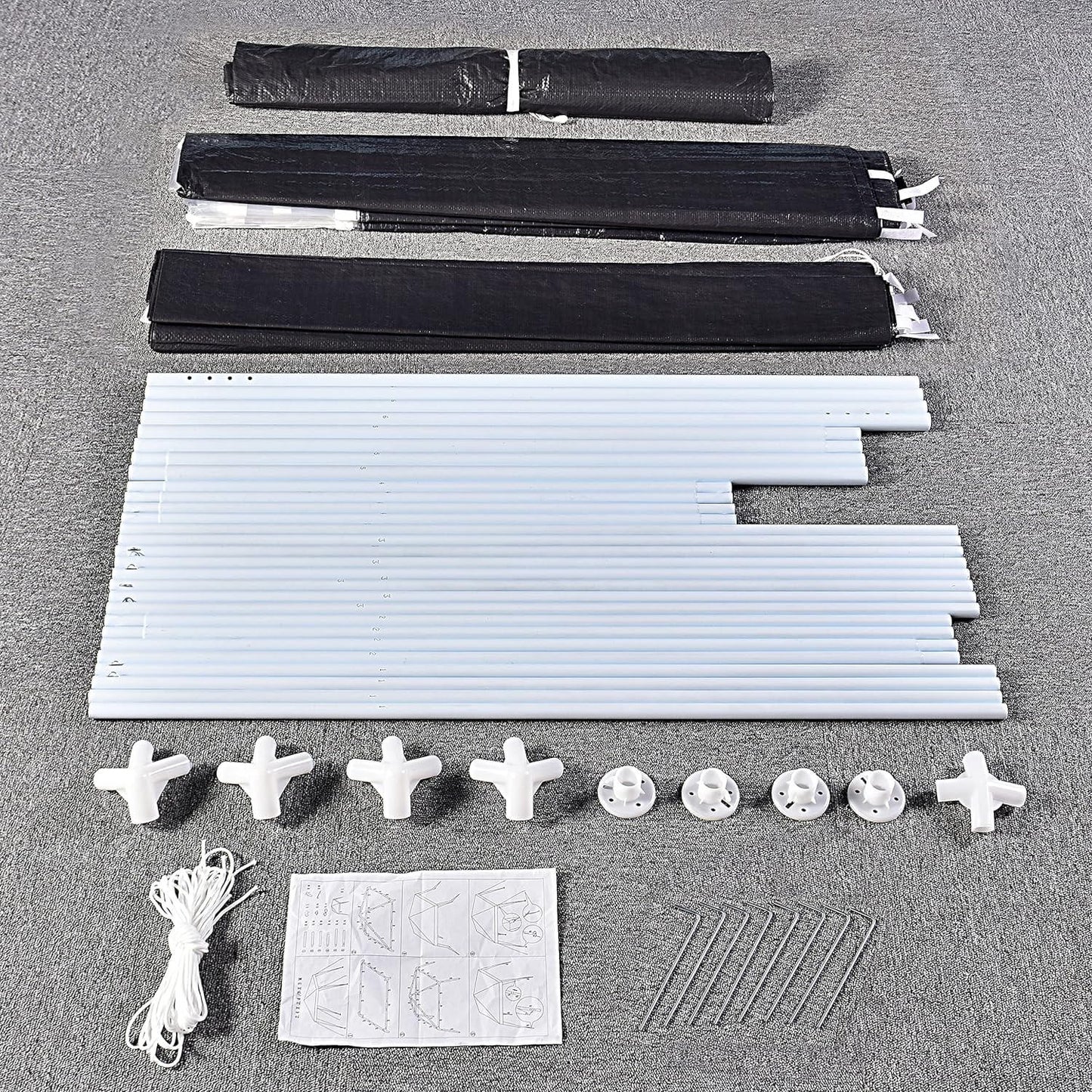 Event gazebo assembly kit with steel tubes, connectors, side panels, and instructions for easy setup.