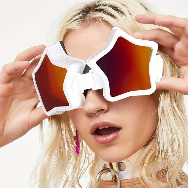 Stylish woman wearing oversized star-shaped mirrored glasses, showcasing bold Y2K fashion accessories.