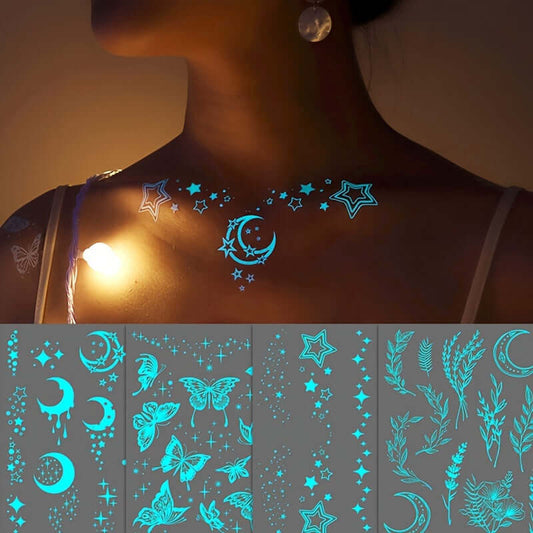 Glow-in-the-dark moon and star tattoos on woman's chest, featuring butterflies and flowers, ideal for festivals and night events.